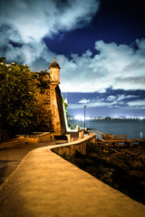 Beautiful El Morro fortress in Old San Juan Puerto Rico seen at night from along Paseo Del Morro