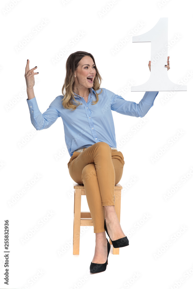 Canvas Prints happy businesswoman holds one and looks to side while celebrating