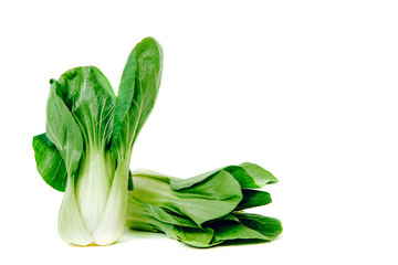 Pak choi cabbage isolated on a white background. The concept of eating vegetables, using vegetables for dishes. Dish for a vegetarian, vegan. Healthy nutrition, eating vitamins.