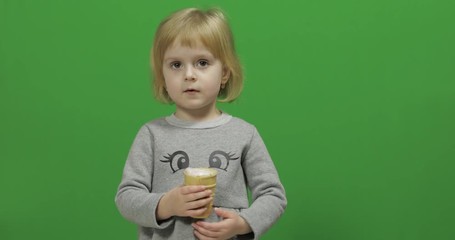 Kid girl with ice cream on a Green Screen, Chroma Key
