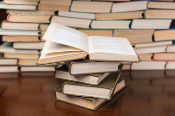 stack of books on the wooden table