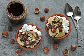 Cottage cheese with banana and hazelnuts. Healthy breakfast or snack. Keto diet.