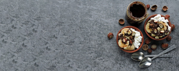 Cottage cheese with banana and hazelnuts. Healthy breakfast or snack. Keto diet.