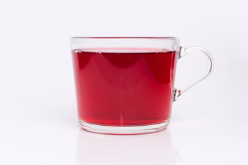 Transparent glass cup with Hibiscus tea isolated on a white background