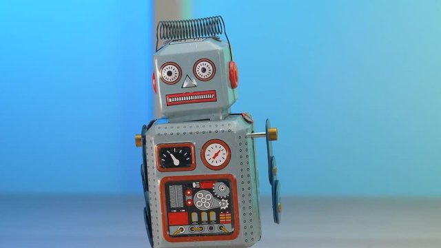 Retro robot toy on a table. Copyspace appearing.