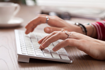 woman hands typing computer keyboard