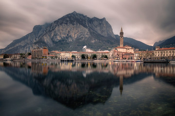 Lecco city reflected on the lake - obrazy, fototapety, plakaty