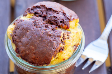 Homemade vegan chocolate cheesecake muffins baked in a jar