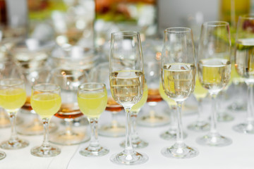 Champagne glasses. Delicious sweet buffet with cupcakes sparkling wine in party.