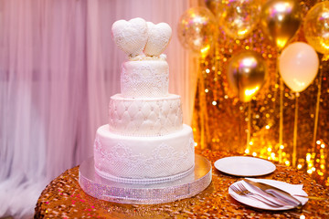 Elegant wedding cake with two hearts.