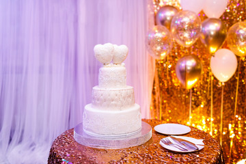 Elegant wedding cake with two hearts.