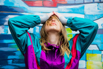 Young woman in jacket of 90s style