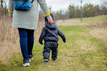 Young mother with toddler boy at outdoor.