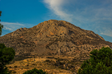 lonely bare mountain peak in wilderness Greece natural scenery landscape environment and evening sunset orange lighting 