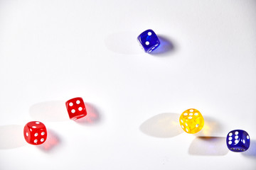 colorful dices in motion on white background