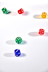 colorful dices in motion on white background