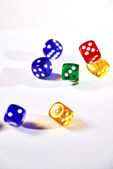 colorful dices in motion on white background