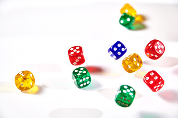 colorful dices in motion on white background