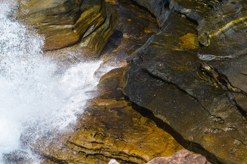 beautiful seaside landscape during sunny day, texture of coastal area, rocks closeup