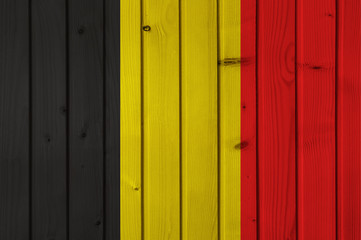 Flag of Belgium on the background of wooden boards. Wallpaper for installation and design. Space for text.
