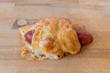 A savoury Czech or Slovak snack food croissant s párkem. A vienna or frankfurter sausage wrapped in pastry.