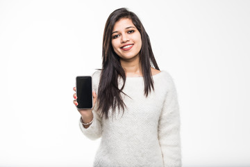 Fototapeta premium Young Indian girl hold a mobile phone screen for copy space isolated on a white background