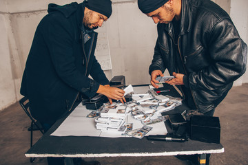Robbers counting money from sack