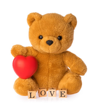 Teddy bear with heart love concept on white background
