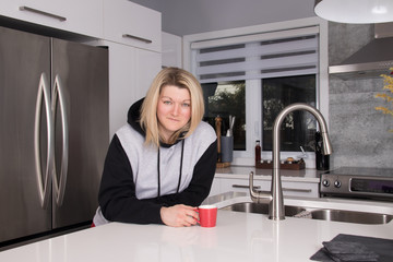 beautiful blond woman having a coffee