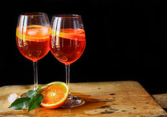 Aperol spritz cocktail in glass on wooden table