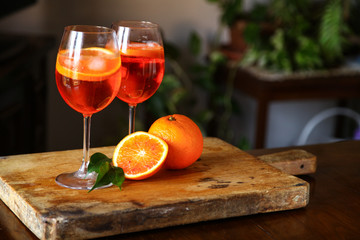 Aperol spritz cocktail in glass on wooden table
