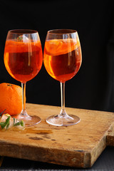 Aperol spritz cocktail in glass on wooden table