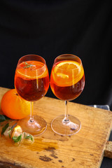 Aperol spritz cocktail in glass on wooden table