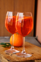 Aperol spritz cocktail in glass on wooden table