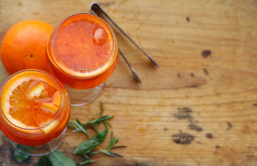 Aperol spritz cocktail in glass on wooden table