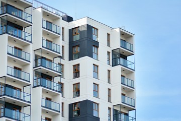 Multistory new modern apartment building. Stylish living block of flats.