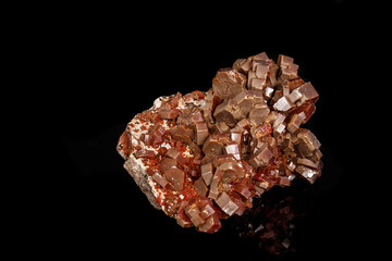Macro mineral stone Vanadinite on a black background