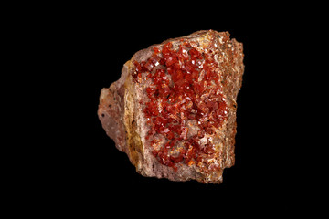 Macro mineral stone Vanadinite on a black background