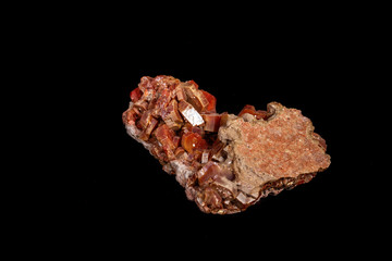 Macro mineral stone Vanadinite on a black background