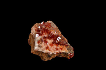 Macro mineral stone Vanadinite on a black background