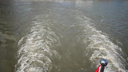 Ship wake on the river, Water foam trace behind the large ship goes, high speed camera, slow motion.