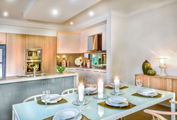 Luxury dining room and kitchen area decorated with flashing candles for ready to serving
