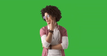 Young man coming up with a brilliant idea over green chroma key background