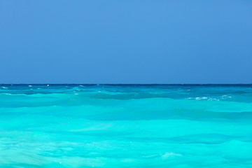 Tropical turquoise sea and clear blue sky.