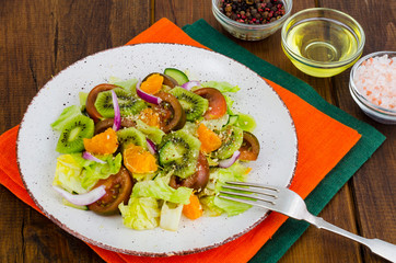 Fruit and vegetable salad with tangerines.
