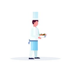 Chef cook carrying plate with fresh fruits