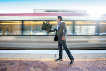 Office man holding a bag at station