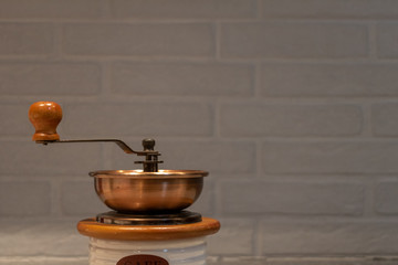 Close up of copper and wood coffee grinder