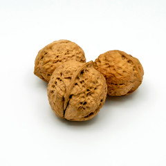 Three Walnuts Isolated on a White Background.