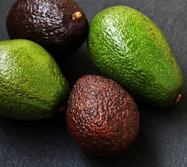avocado background. different types and varieties of avocado. space for text. copy space. healthy diet fats, keto diet.